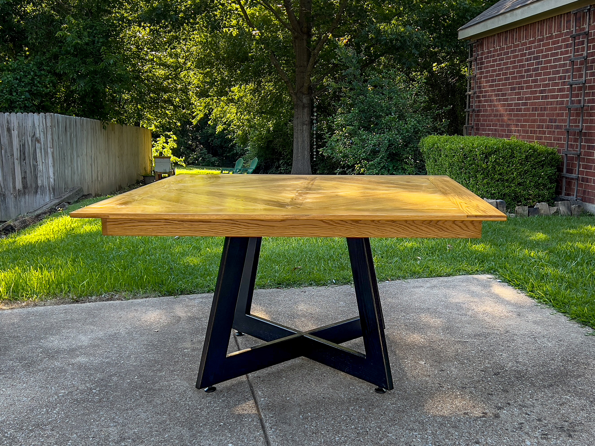 white oak table with black base for the deck or patio