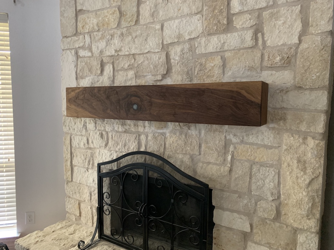handcrafted walnut fireplace mantel